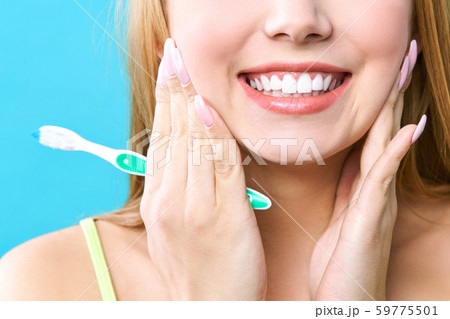 Perfect healthy teeth smile of a woman. Teeth Whitening. Dental health Concept. Promotional picture Perfect healthy teeth smile of a woman. Teeth Whitening. Dental health Concept. Promotional picture 59775501