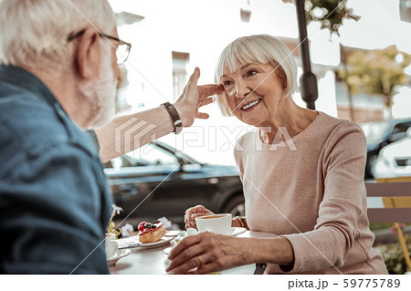 Nice aged man touching his wifes hair 59775789