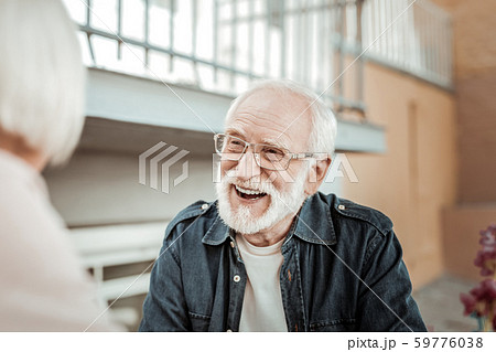 Joyful bearded aged man feeling absolutely happy 59776038