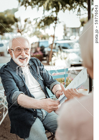 Delighted bearded man being in a great mood 59776043