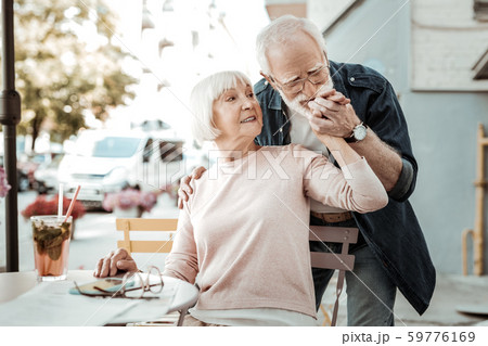 Nice aged man kissing his wifes hand Nice aged man kissing his wifes hand 59776169