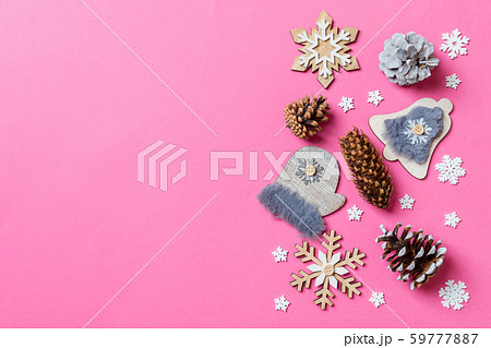 Top view of holiday toys and decorations on pink 59777887