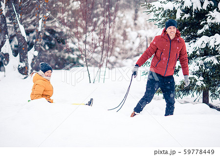Family of dad and kids vacation on Christmas eve outdoors 59778449
