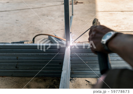 Industrial welder are welding steel pipe Industrial welder are welding steel pipe 59778673