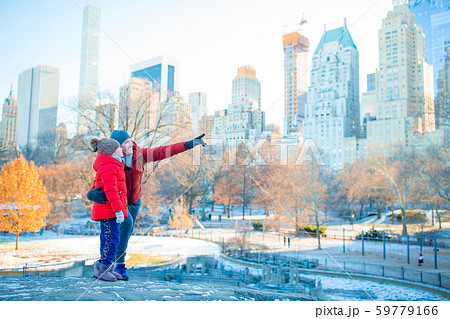Family of father and little kid in Central Park during their vacation in New York City 59779166