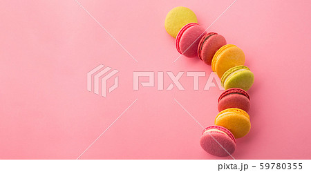 Sweet macarons on pink background 59780355