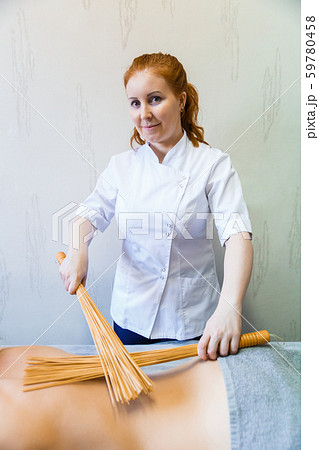 Back massage in the massage room with bamboo 59780458