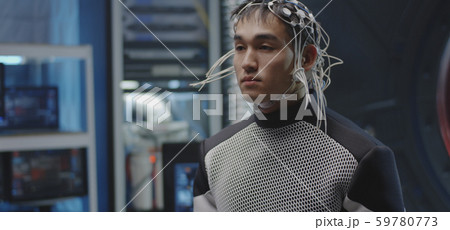 Astronaut walking with sensors on his head 59780773