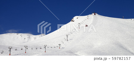 Ski slope with ropeway at sun winter day 59782157