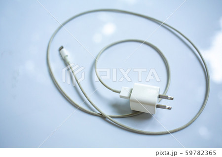 Smart Phone Charger Cable on white acrylic table background, Close up & Macro shot, Selective focus, Technology, Business concept 59782365