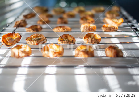 Baked Cavendish Banana, KInd of banana on steel grating, Light & Shadow, Close up & Macro shot, Selective focus, Healthy food concept 59782928