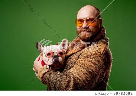 Man with french bulldog in his arms 59783695