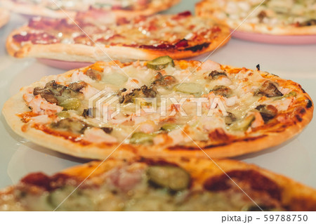pizza with mushrooms and cucumbers closeup pizza with mushrooms and cucumbers closeup 59788750