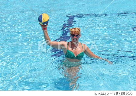 Fashionable woman with ball for rugby swimming in Fashionable woman with ball for rugby swimming in 59789916