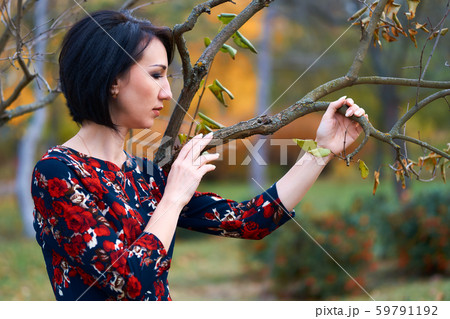 Beautiful elegant woman standing and posing near 59791192