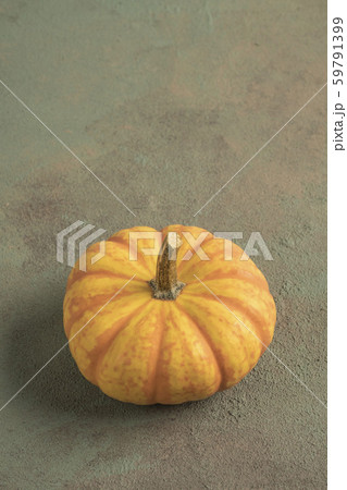 A small pumpkin on green with copy space 59791399