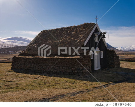 Peat church in Iceland with a bell above the door Peat church in Iceland with a bell above the door 59797640