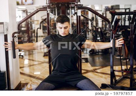 A handsome man is engaged in a gym A handsome man is engaged in a gym 59797857