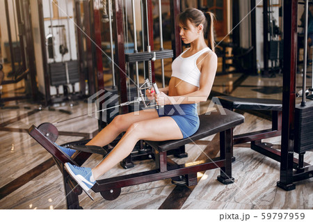 A beautiful girl is engaged in a gym A beautiful girl is engaged in a gym 59797959