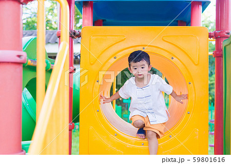 Cute Asian boy playing and smiling in yellow 59801616