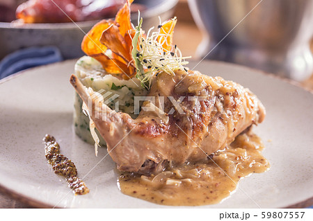 Rabbit leg with mashes potatoes and decoration on 59807557