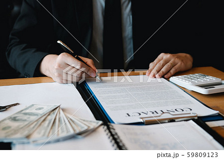 New home buyers are signing a home purchase 59809123