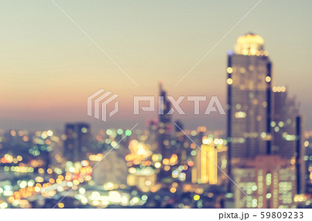 Blur city background rooftop view of cityscape business building landscape night lights bokeh in vintage tone Blur city background rooftop view of cityscape business building landscape night lights bokeh in vintage tone 59809233