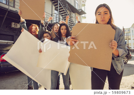 Young people protesting of women rights and equality on the street Young people protesting of women rights and equality on the street 59809673