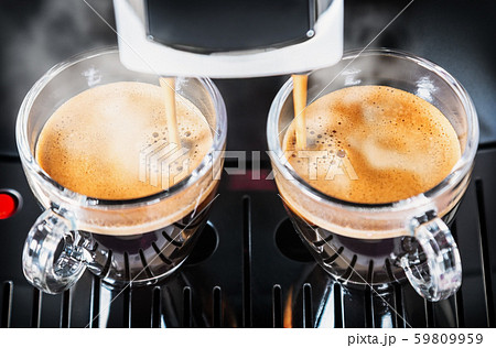 cups of freshly brewed coffee in the coffee machine cups of freshly brewed coffee in the coffee machine 59809959