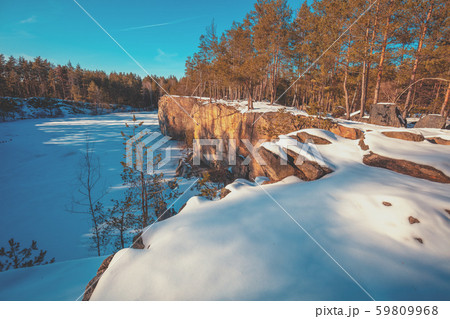 Winter nature. Granite rocky frozen lake shore Winter nature. Granite rocky frozen lake shore 59809968
