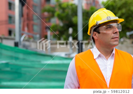 Handsome Persian man construction worker at the construction sit Handsome Persian man construction worker at the construction sit 59812012