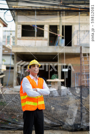 Handsome Persian man construction worker at the construction sit Handsome Persian man construction worker at the construction sit 59812081
