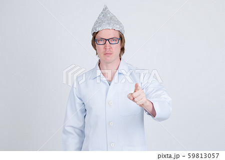 Young man doctor with tinfoil hat pointing at camera 59813057