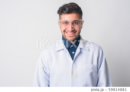 Face of happy Persian man doctor as scientist smiling 59814881