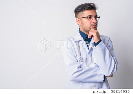 Portrait of young Persian man doctor thinking 59814959