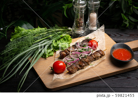 lamb skewers with pickled onions and cilantro on a lamb skewers with pickled onions and cilantro on a 59821455