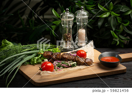 lamb skewers with pickled onions and cilantro on a lamb skewers with pickled onions and cilantro on a 59821456