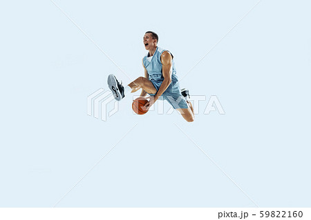 Young caucasian basketball player against white studio background 59822160