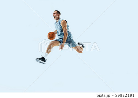 Young caucasian basketball player against white studio background Young caucasian basketball player against white studio background 59822191