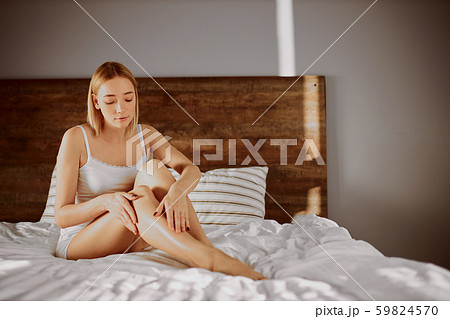pretty woman touching smooth legs pretty woman touching smooth legs 59824570