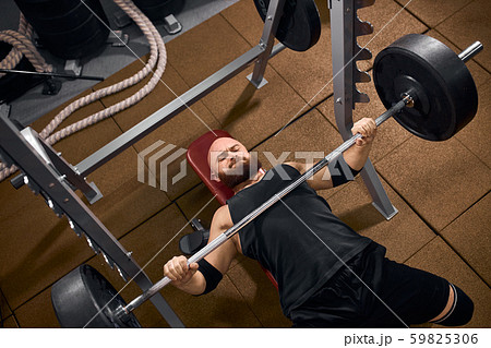 male powerlifter preparing to bench press 59825306