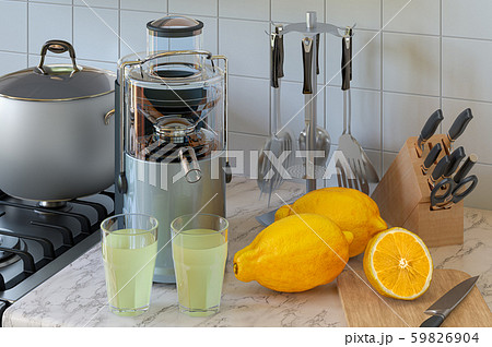 Lemon juice and electric juicer on kitchen table 59826904