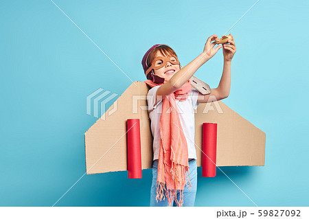 Portrait of smiling pilot kid 59827092