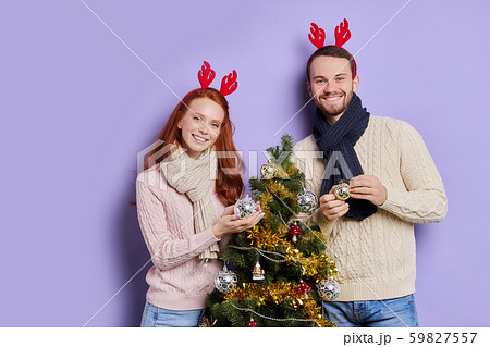 Happy couple in stylish sweaters in studio 59827557
