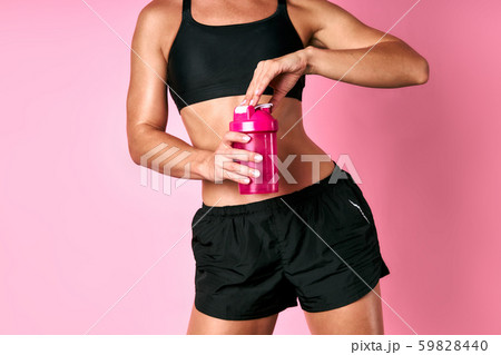 Sporty female with bottle of water Sporty female with bottle of water 59828440