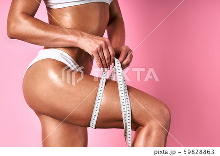 beautiful model measuring waist 59828863