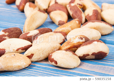 Heap of brazil nuts on old boards 59835158