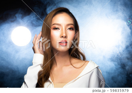 Asian Woman curl blonde hair style throwing flying 59835979