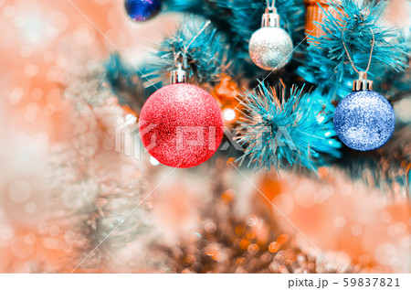 Christmas balls on artificial spruce close-up 59837821