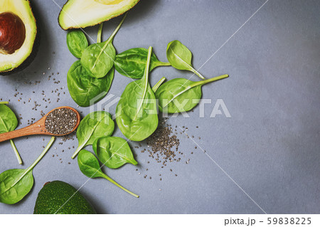 Avocado, spinach and chia seed on grey stone background, top view. 59838225